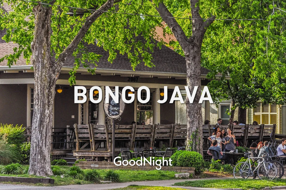 The exterior of Bongo Java with its welcoming sign, outdoor seating beneath the trees, and people socializing, encapsulating Nashville's vibrant, community-centered cafe culture.