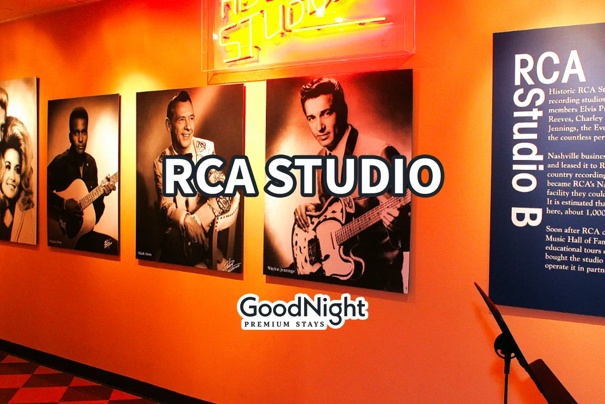 A warmly lit interior filled with historic photographs of musicians, a neon studio sign reminiscent of recording studios, and an informational plaque. The wall is adorned with black-and-white images of legendary performers, creating an atmosphere steeped in music history and inspiration.