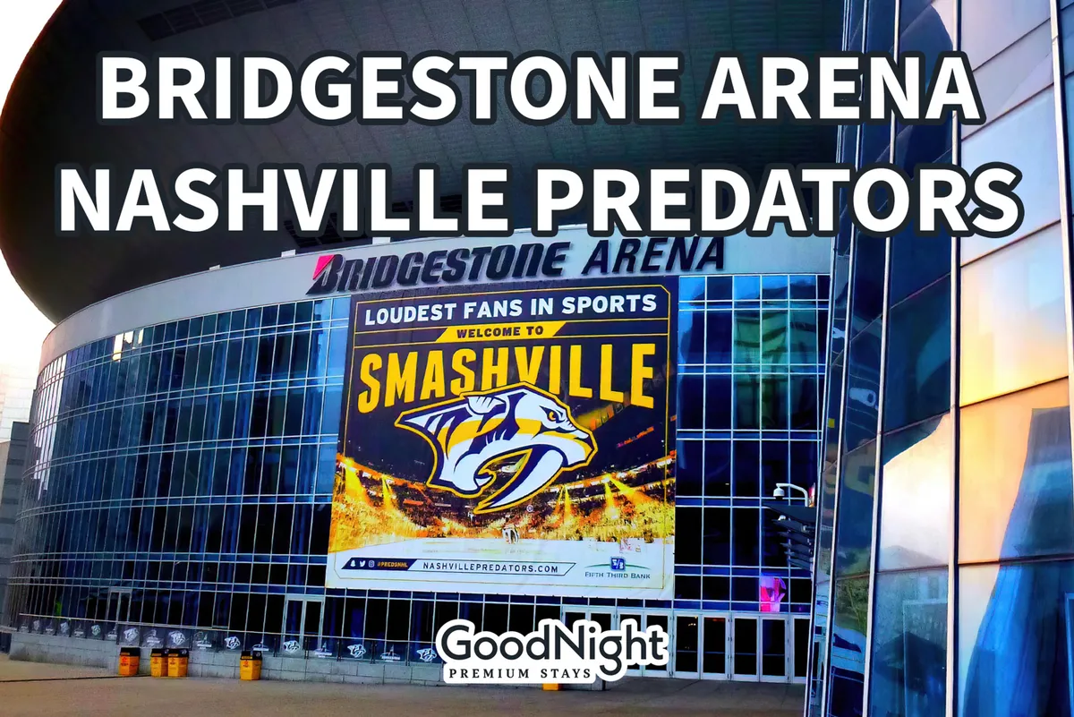 An exterior view of Bridgestone Arena, complete with the prominent Bridgestone sign, the Nashville Predators logo, and a welcoming ‘Welcome to Smashville’ banner. The arena stands ready to host concerts, sports, and major local events.